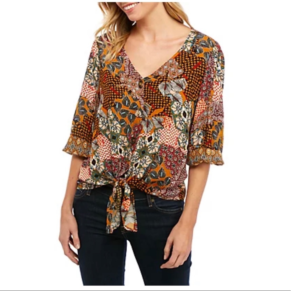 New Directions®
3/4 Sleeve Button Down Textured Tie Front Top
UPC: 0682173170317